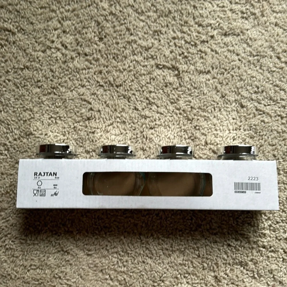 IKEA set of four Rajtan glass spice jars with silver lids
